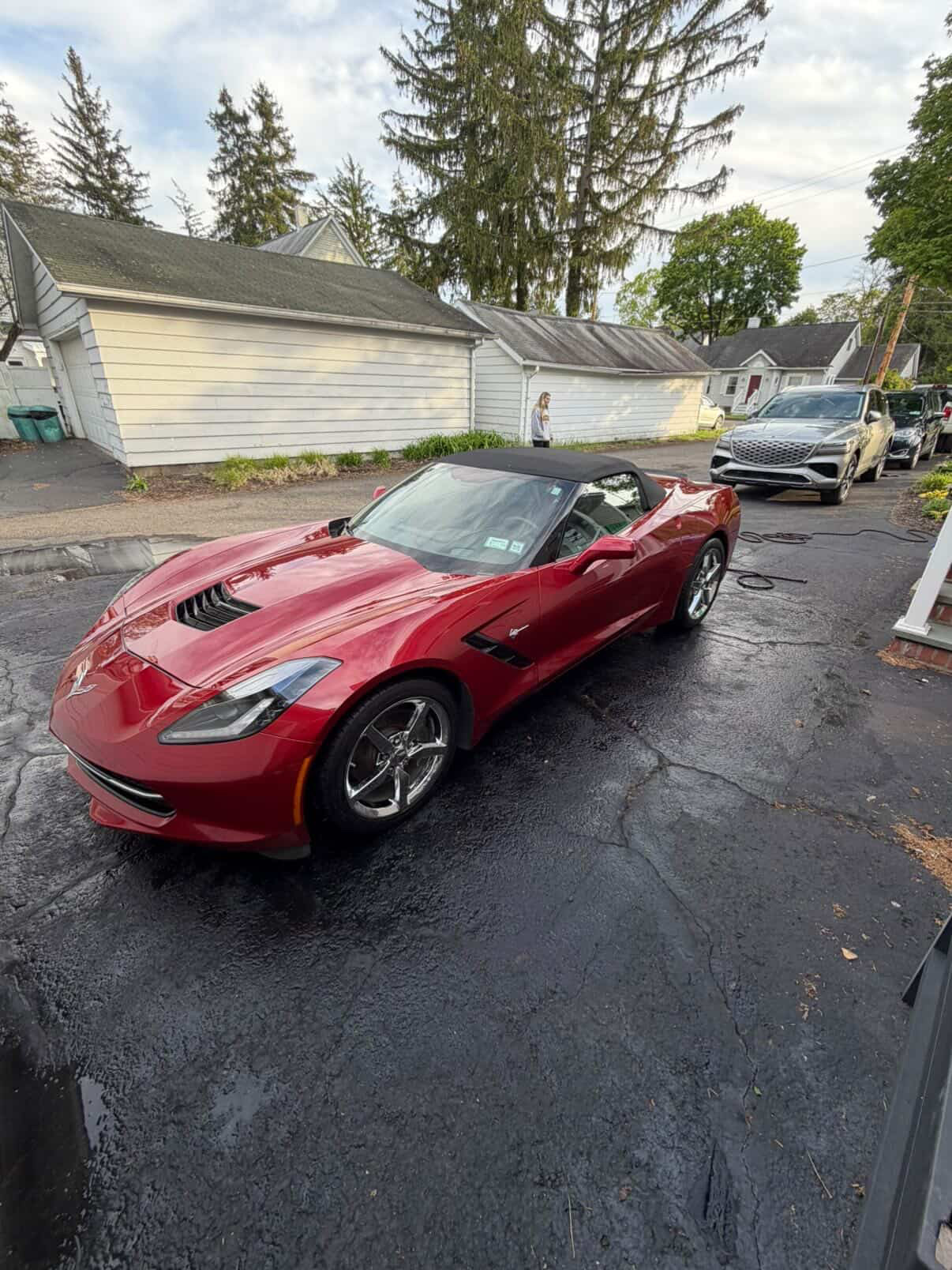 Freshly detailed red Chevrolet Corvette with a mirror-glossy finish